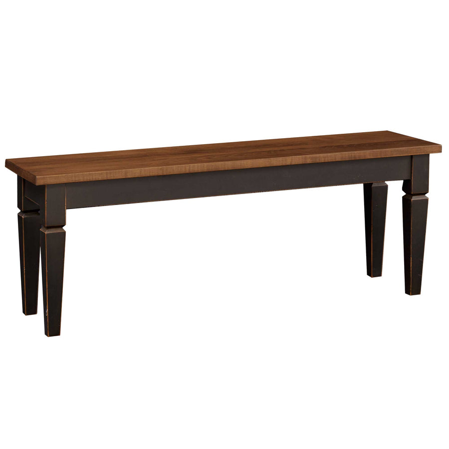 Dining bench with a warm brown plank seat and distressed black tapered legs on a white background