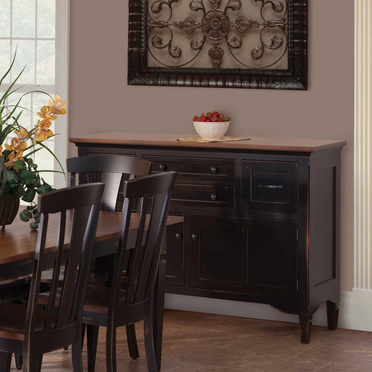 Large distressed black dining buffet with an oak top, four drawers and two paneled doors in a dining room
