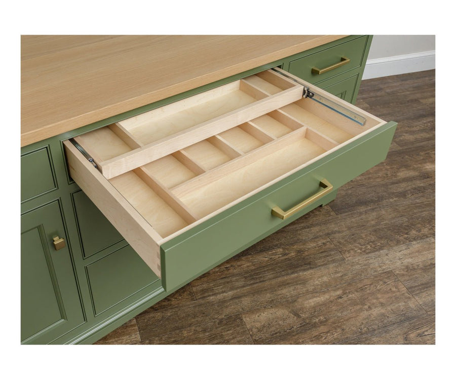 Open drawer of the green buffet showing a maple silverware divider tray on full-extension slides