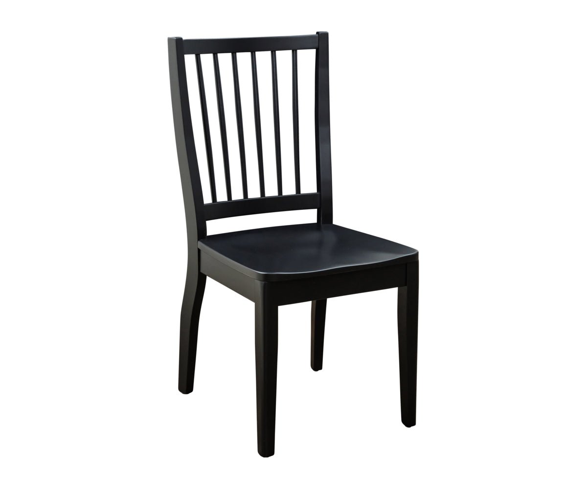 Black painted dining chair with seven vertical back slats, contoured wood seat and tapered legs on white