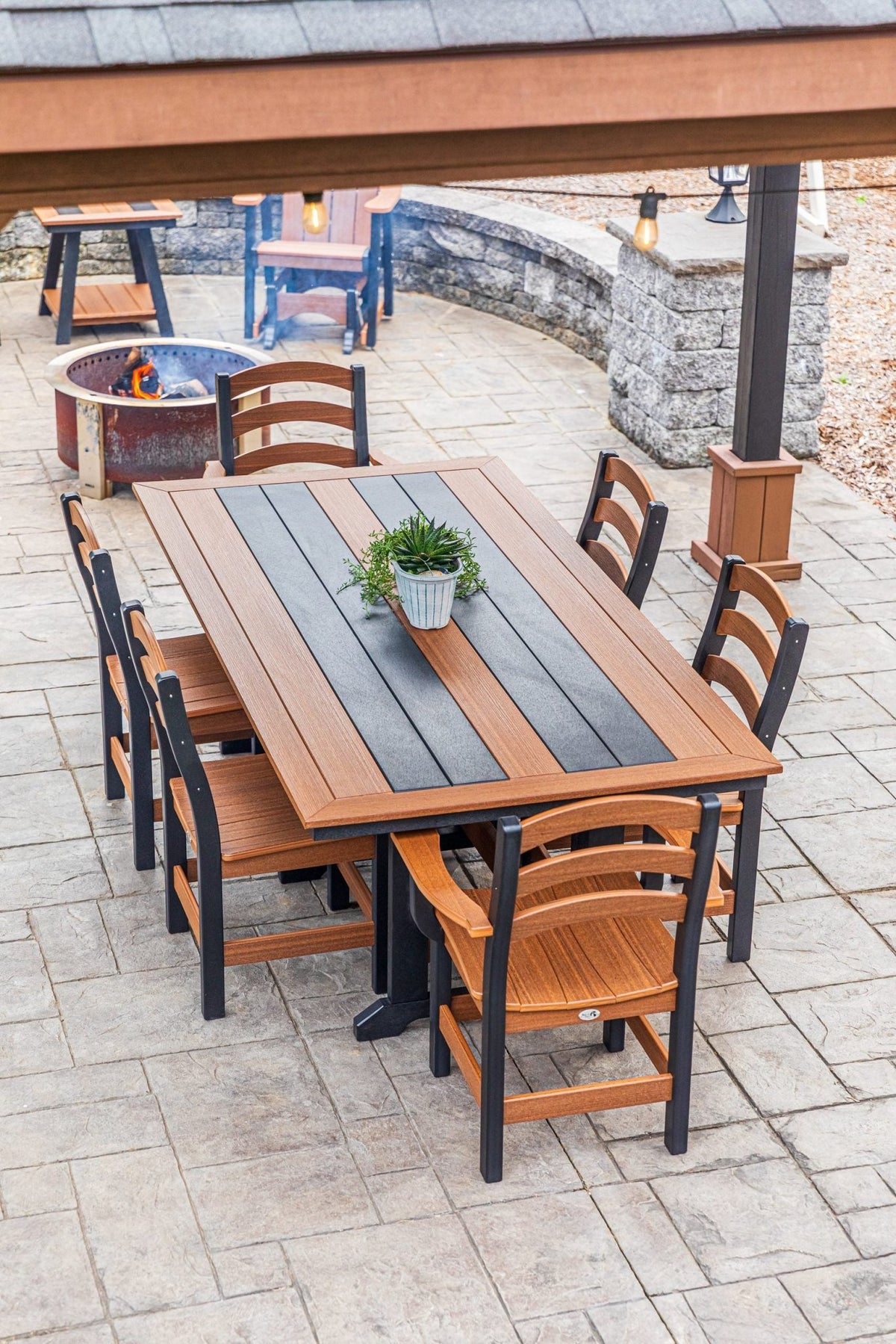 Long Beach 43 x 84 inch poly dining table with two arm chairs and side chairs, mahogany and black (photo 5)