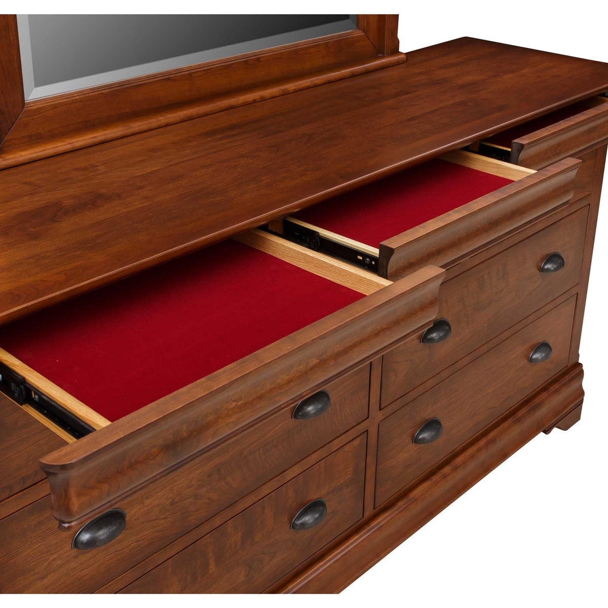 Two open red felt-lined top drawers on the cherry dresser, showing full-extension slides beneath the mirror