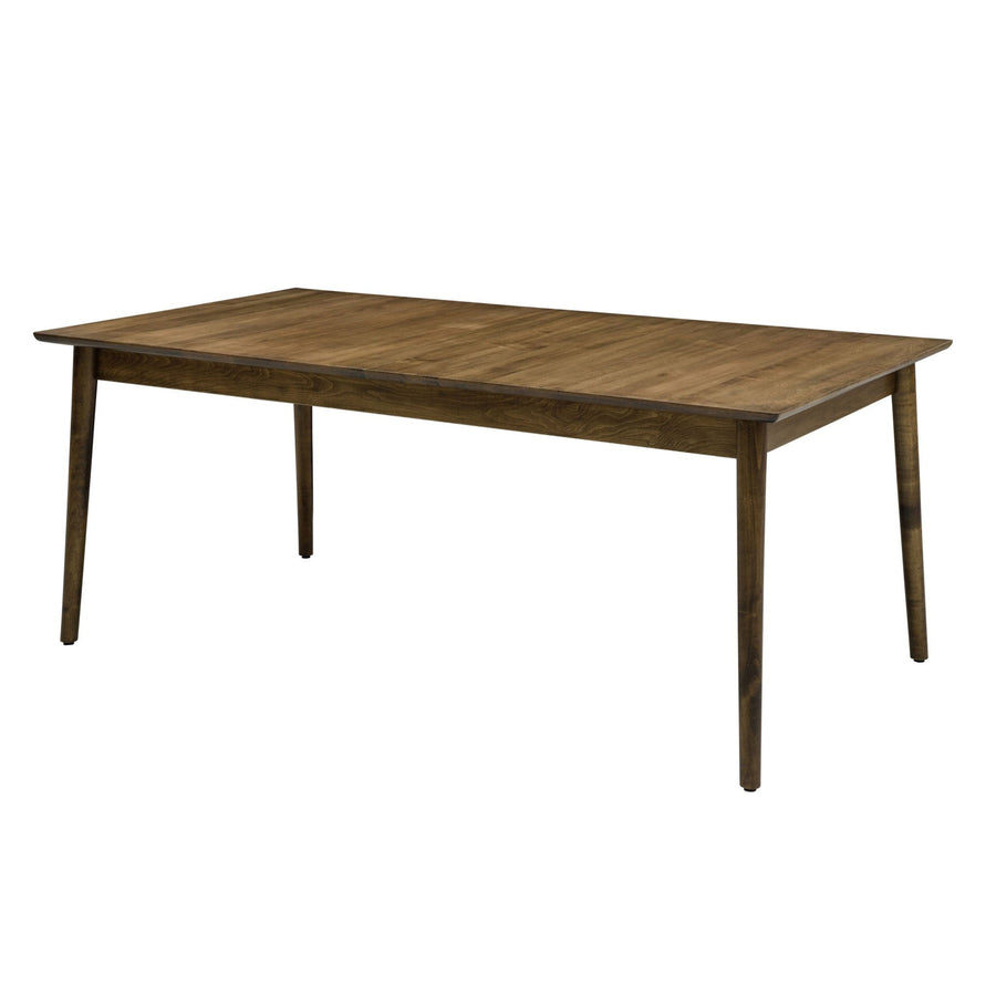 Rectangular mid century dining table with a walnut top and round tapered legs on a white background