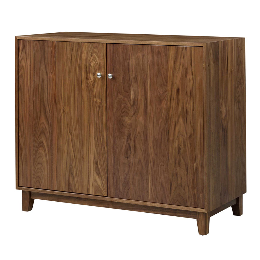 Two-door walnut dining server with book-matched grain, small round knobs and a tapered plinth base