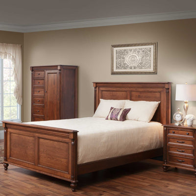 Cherry Milano panel bed with tall gentleman's chest and nightstand in a warm styled bedroom with framed wall art