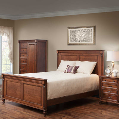 Cherry Milano panel bed with tall gentleman's chest and nightstand in a warm styled bedroom with framed wall art