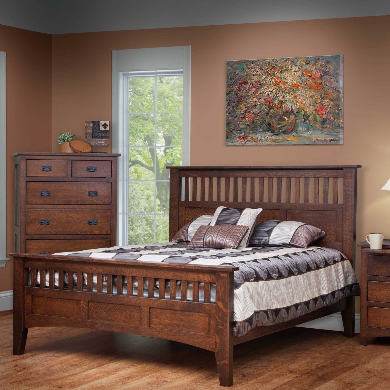 Quartersawn oak mission slat bed with matching chest of drawers and nightstand in a bedroom with rust walls
