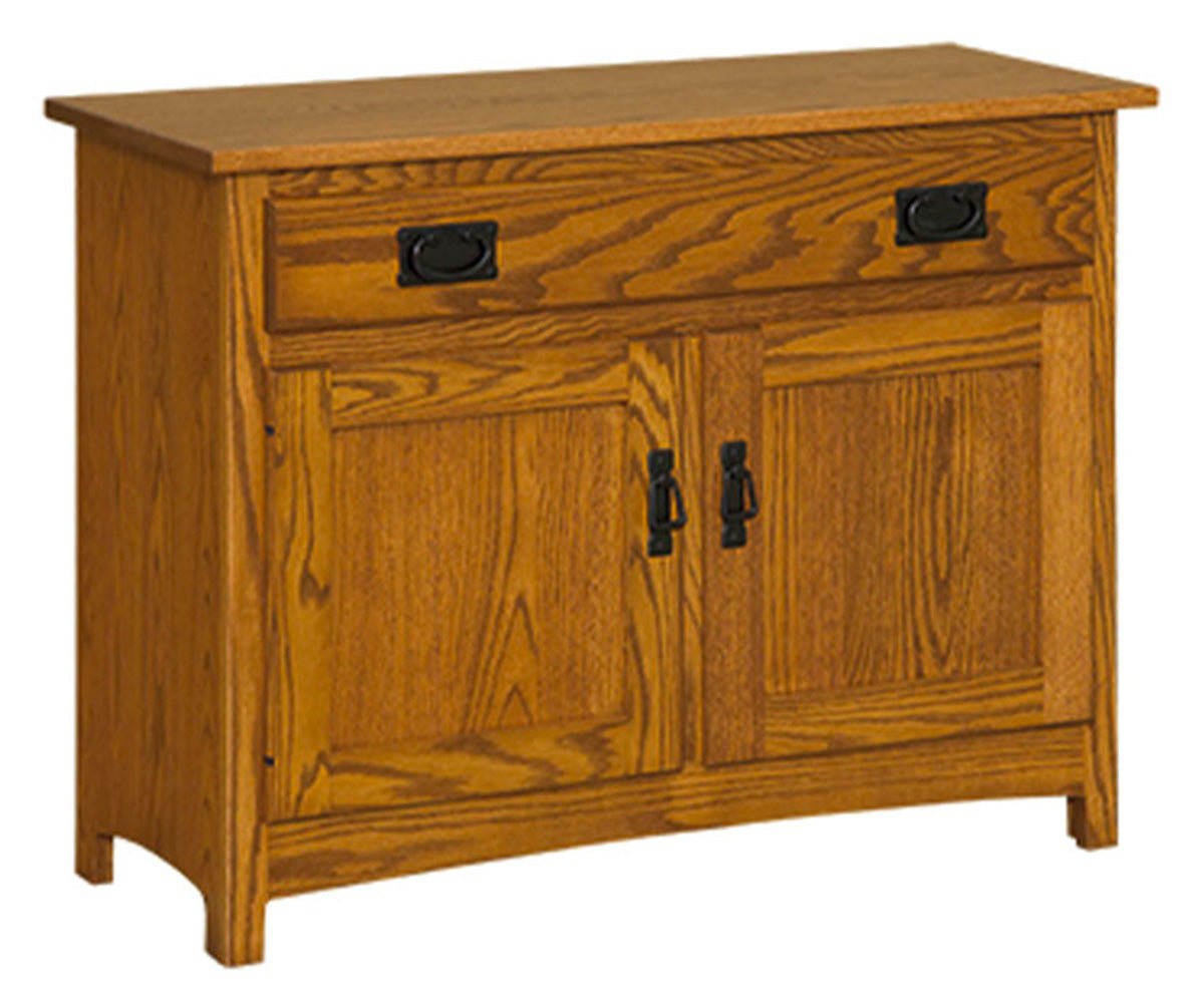 Mission oak hall console with a long top drawer, two panel doors, black bail pulls and an arched skirt
