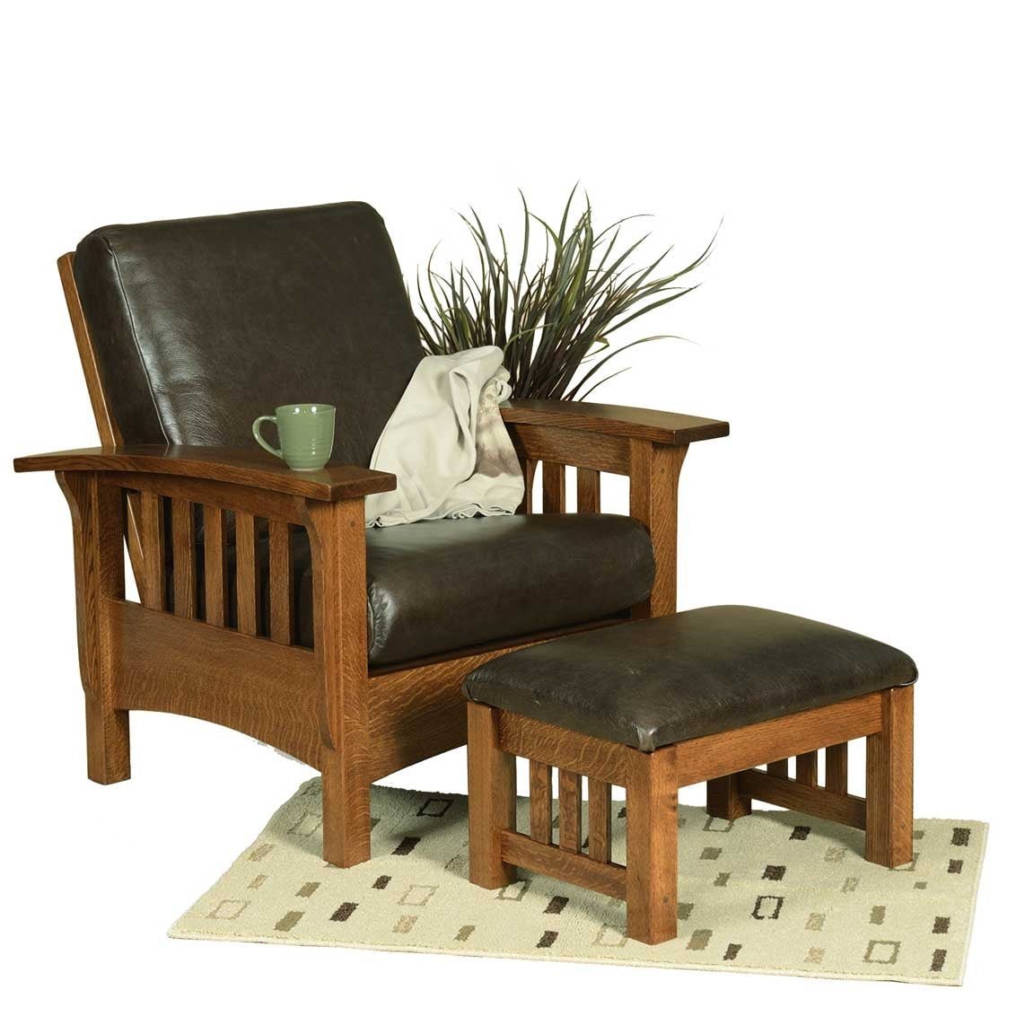 Quartersawn oak Morris chair and ottoman set with dark brown leather cushions, slat sides and arched lower rails