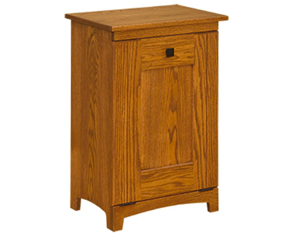 Oak Mission tilt-out trash bin cabinet with a single paneled door, small black pull and an arched apron