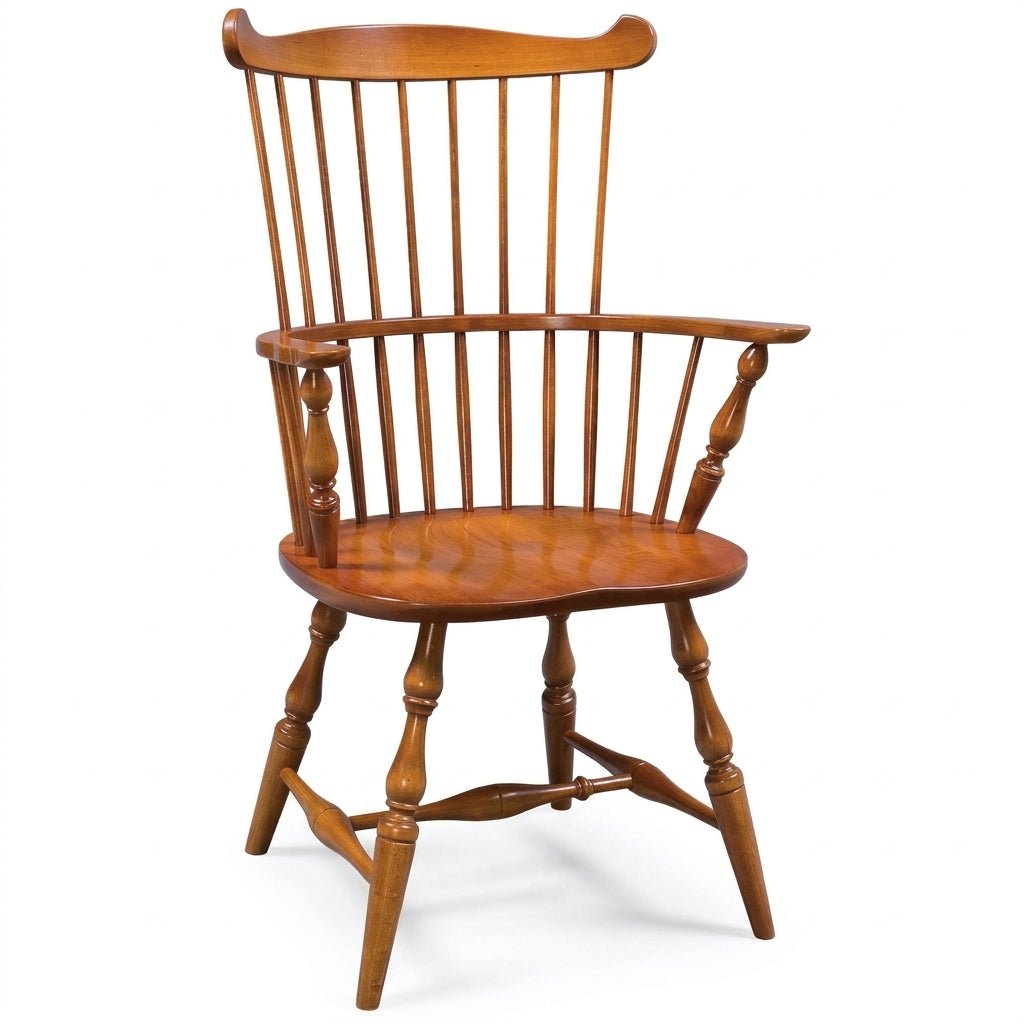 A classic wooden spindle-back chair with turned legs and armrests, shown on a plain white background.