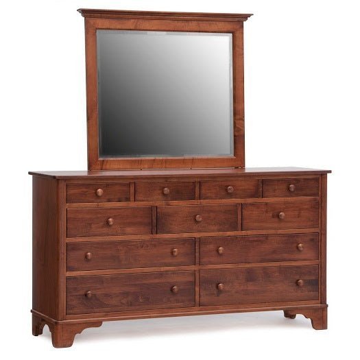 Cherry eleven-drawer dresser with a beveled rectangular mirror, round wood knobs and shaped bracket feet