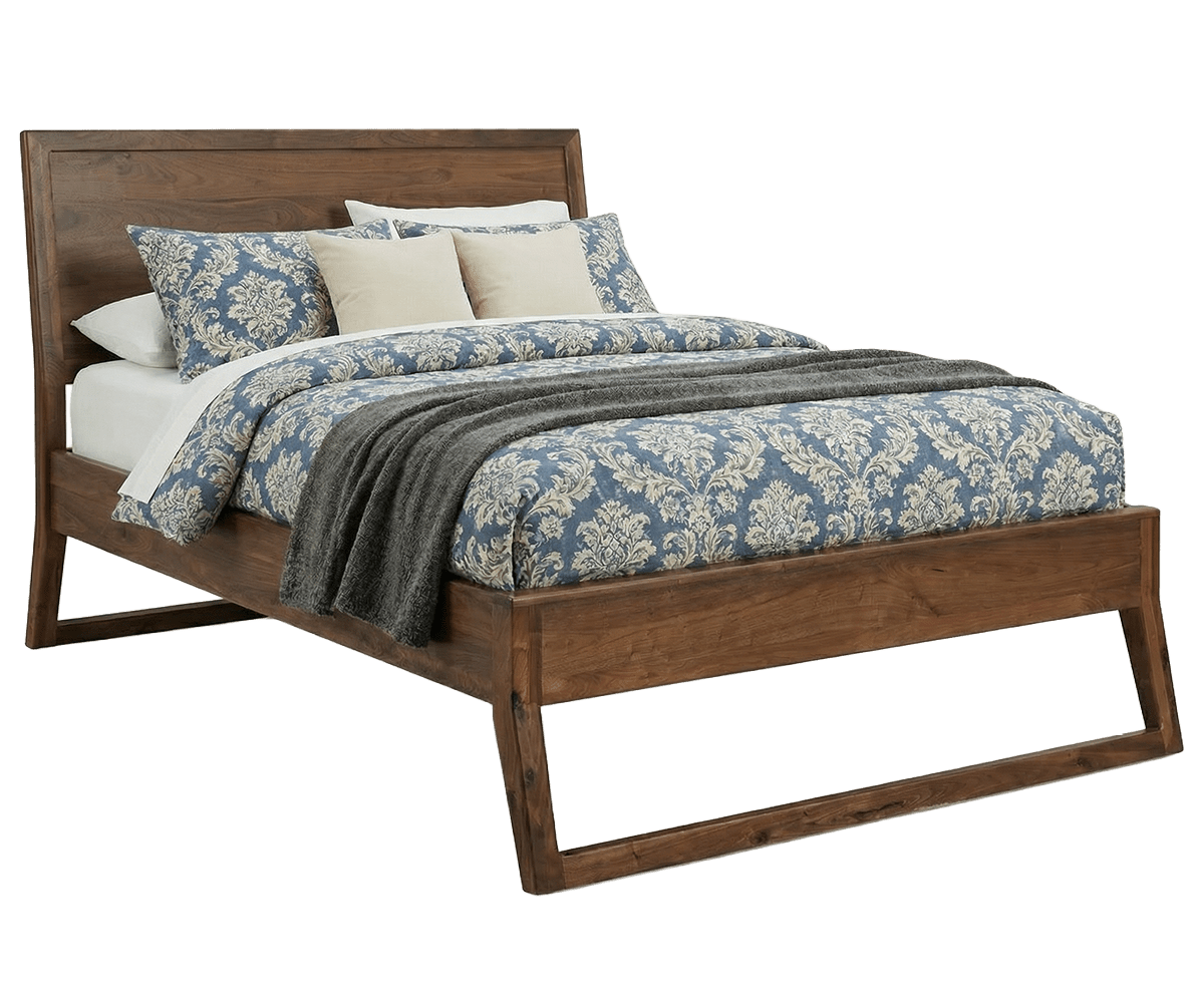 Angled view of the walnut mid century bed with paneled headboard and sled base, styled with white bedding