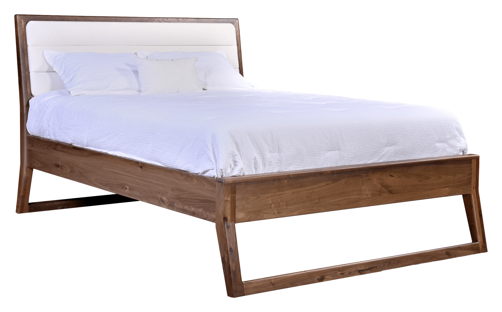 Upholstered bed with white fabric headboard panel framed in walnut, angled legs and crisp white bedding