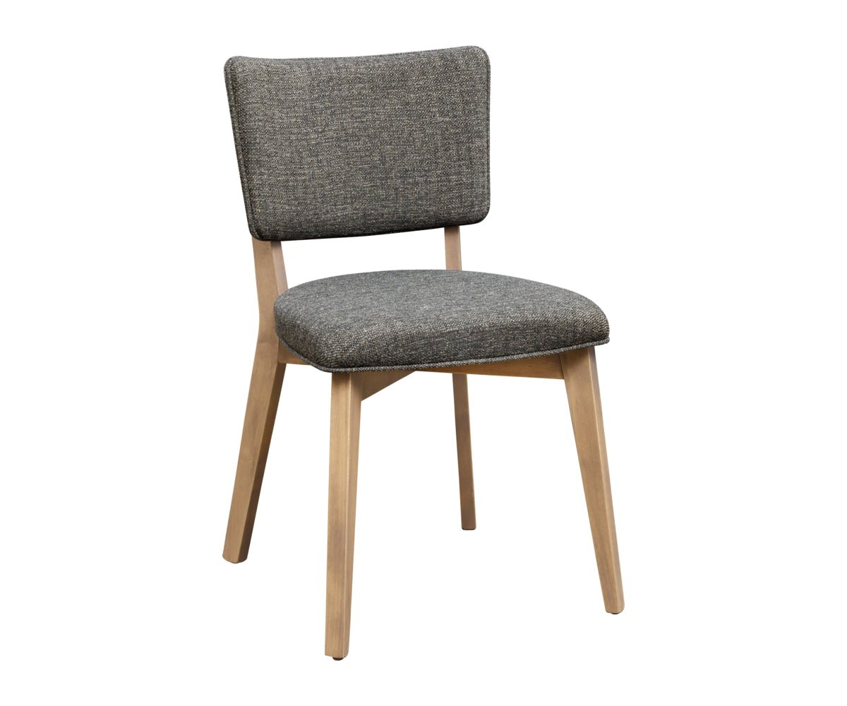 Dining chair with a charcoal tweed cushioned seat and back on a whitewashed oak frame, white background