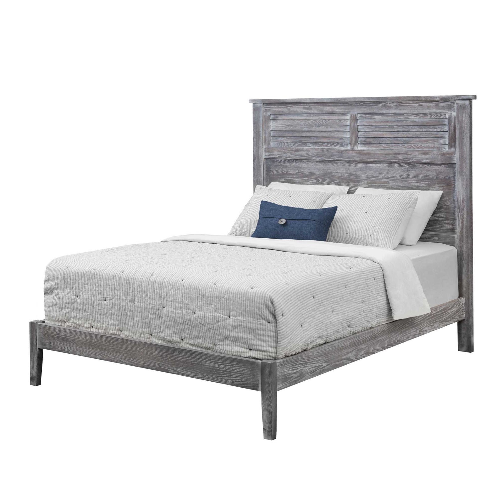 Weathered gray louver panel bed with a low footboard and white quilted bedding in a coastal styled bedroom