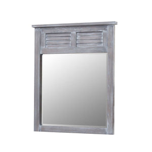 Oreland louver mirror in weathered gray brushed oak with a louvered shutter panel above beveled glass