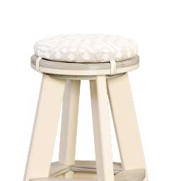 Cream poly backless stool with a round patterned cushion pad strapped over the seat