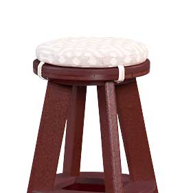 Round patterned seat cushion tied to the top of a cherry red poly backless stool