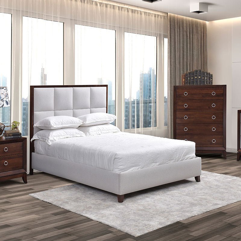 Modern high rise bedroom with white upholstered panel bed, five drawer chest, two tone dresser and mirror