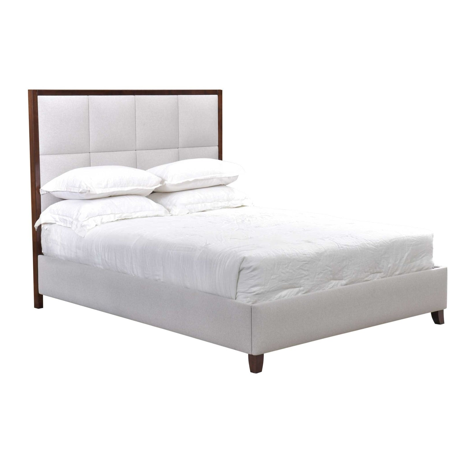 White upholstered square tufted bed with wood trimmed headboard beside a nightstand and chest in a city bedroom