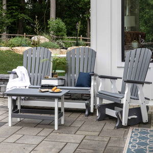 Gray and white poly Adirondack console glider bench and glider chair with matching coffee table on pavers