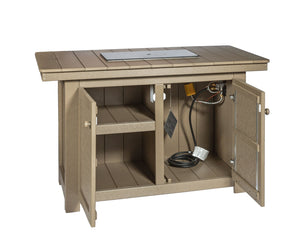Tan poly fire pit island shown with cabinet doors open, revealing an interior shelf, outlet and gas connection