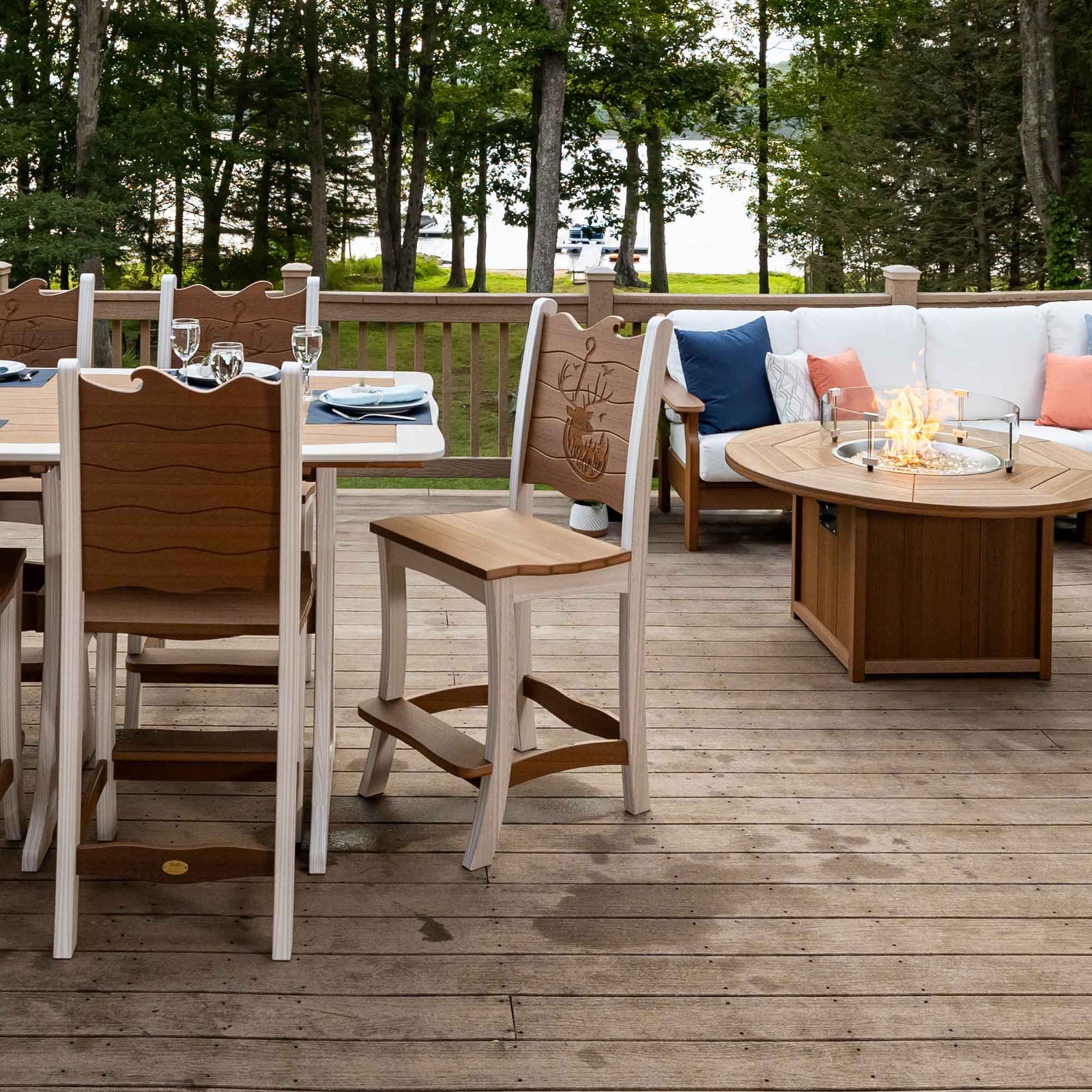 Wave back poly bar chairs with footrests at a dining table on a lakeside deck near a fire pit table and sectional