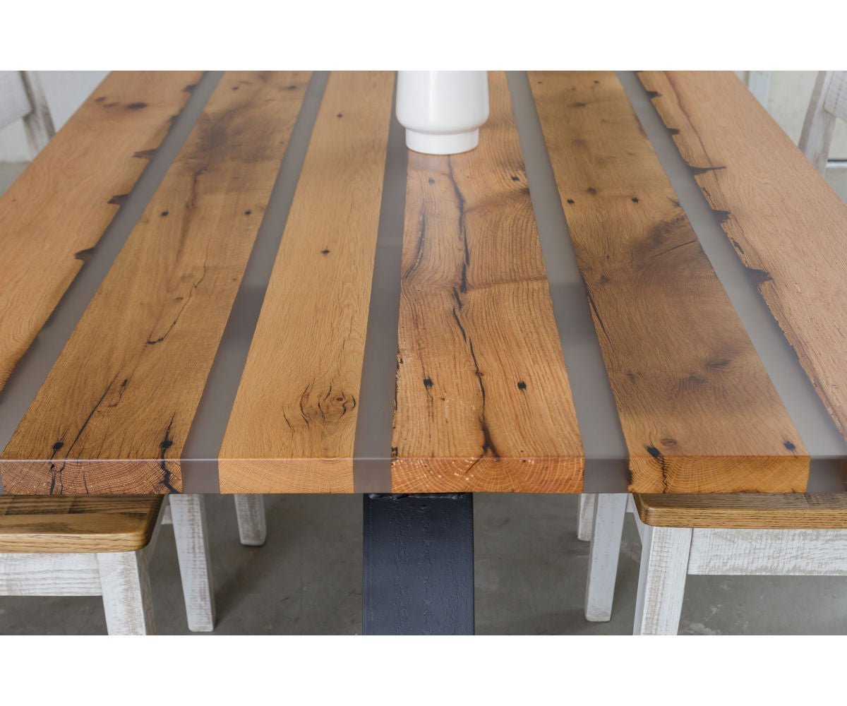 Top view detail of the resin filled reclaimed plank table showing knots, cracks and a smooth finish