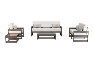 Gray frame poly patio set with crisp white cushions, woven pillows, coffee table and square side table