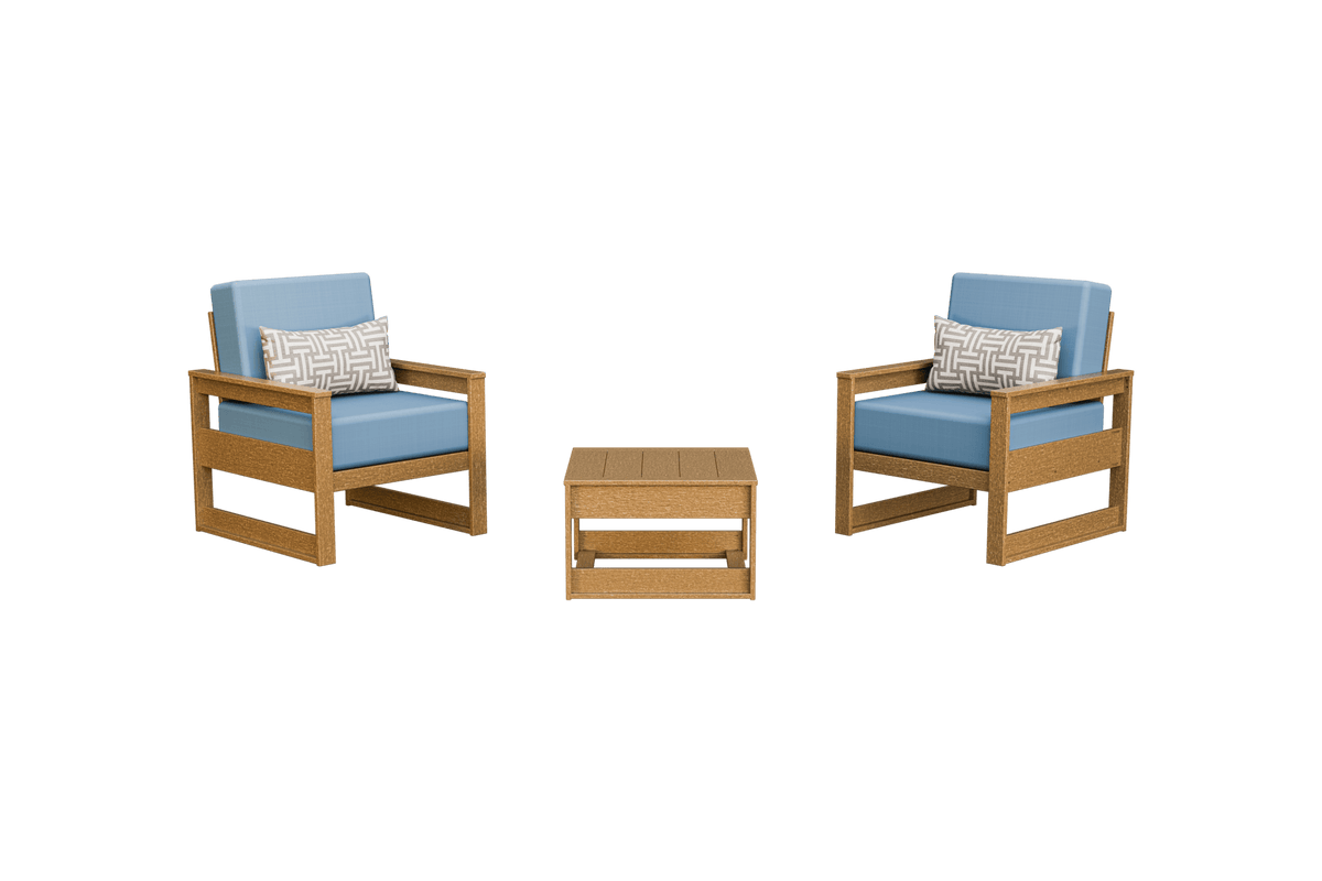Light teak toned poly patio chairs with blue cushions and patterned pillows beside a matching side table