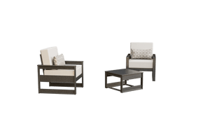 Two brown poly frame patio chairs with cream cushions and patterned pillows beside a low square side table