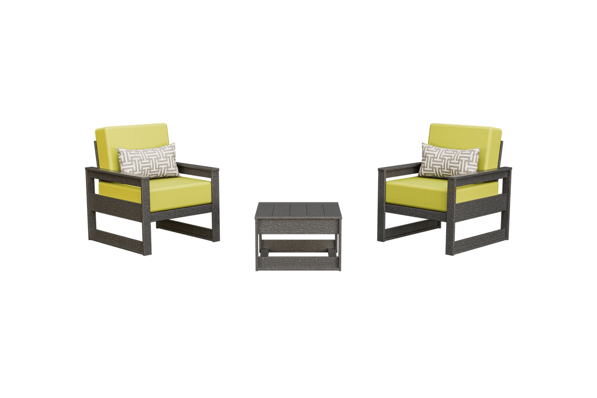 Two gray poly club chairs with yellow-green cushions and patterned pillows beside a low side table