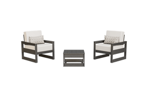 Gray frame poly chair set with bright white cushions, geometric pillows and a slatted side table on white