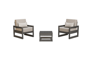 Two dark gray poly patio club chairs with taupe cushions and woven pillows beside a square side table
