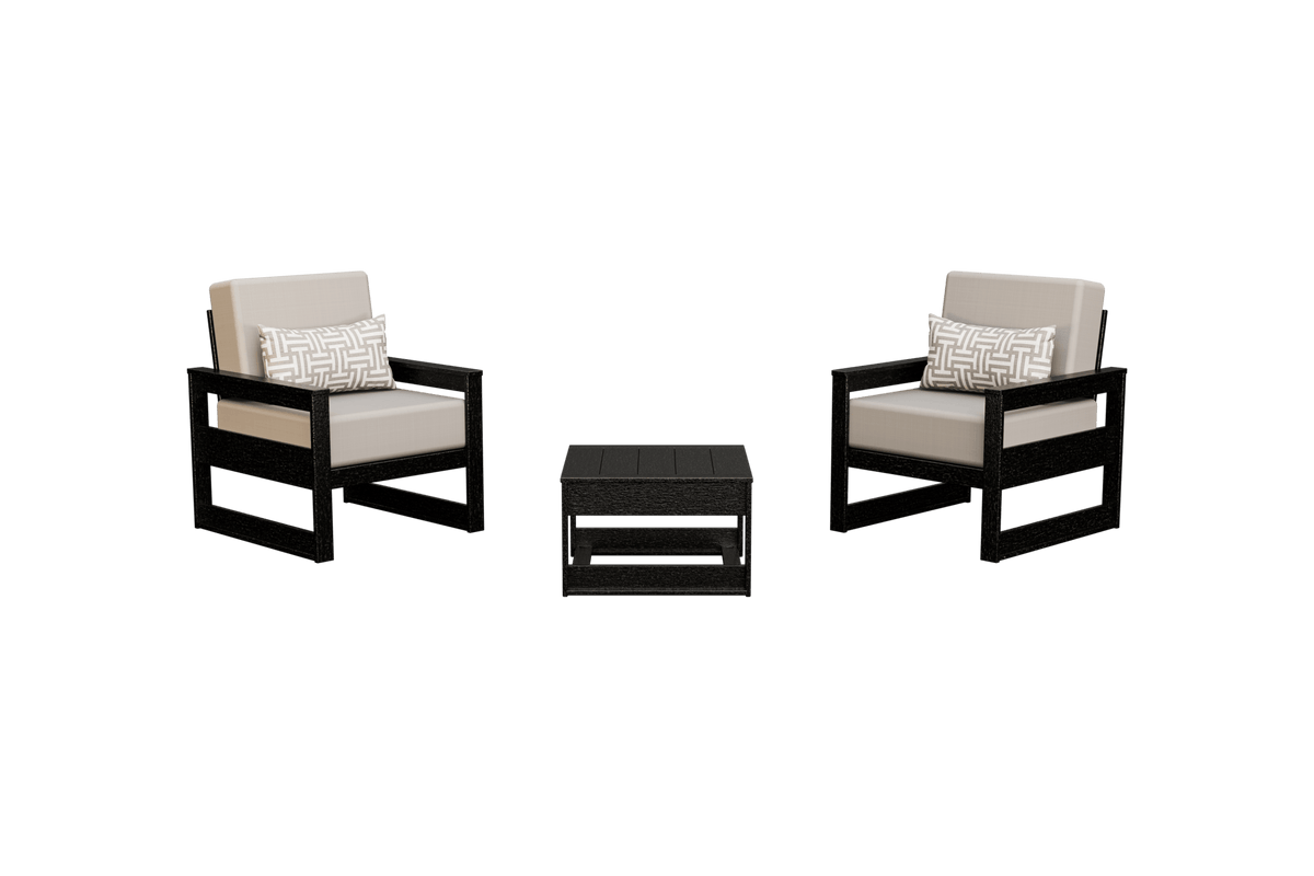 Pair of black frame poly club chairs with beige cushions and woven accent pillows with a side table