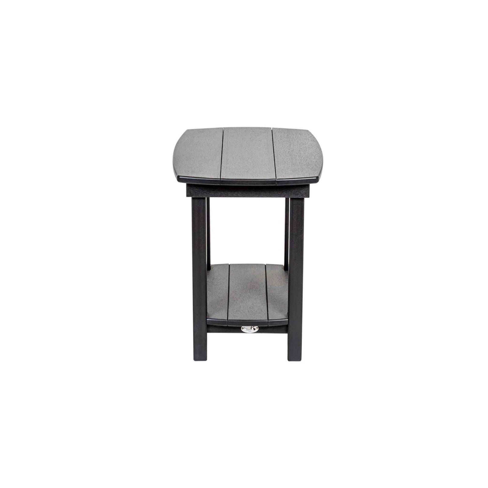 Black poly end table with a lower shelf sitting between two black porch rockers on a concrete patio