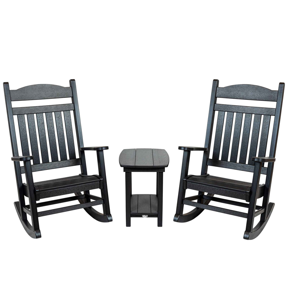 Set of two black slat back poly rocking chairs with a small end table between them on white