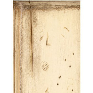 Finish sample of a pale weathered wood panel with distress marks, worm holes and dark glazed edges