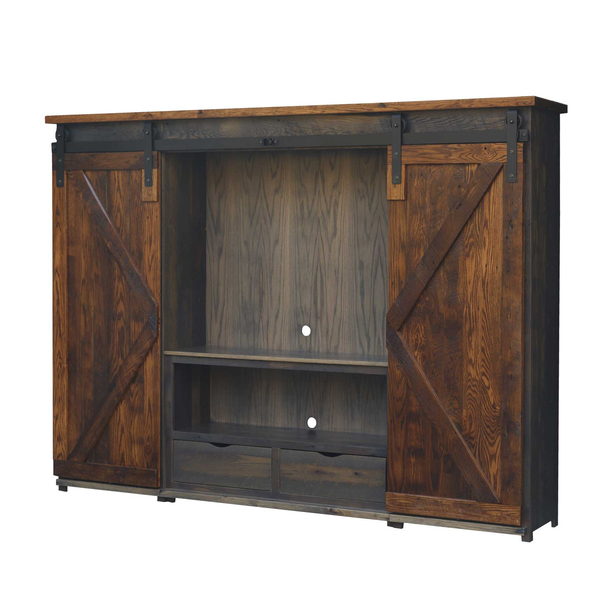 Dark antique stained reclaimed wood entertainment center with two X-braced sliding barn doors, open TV compartment and two center drawers on white