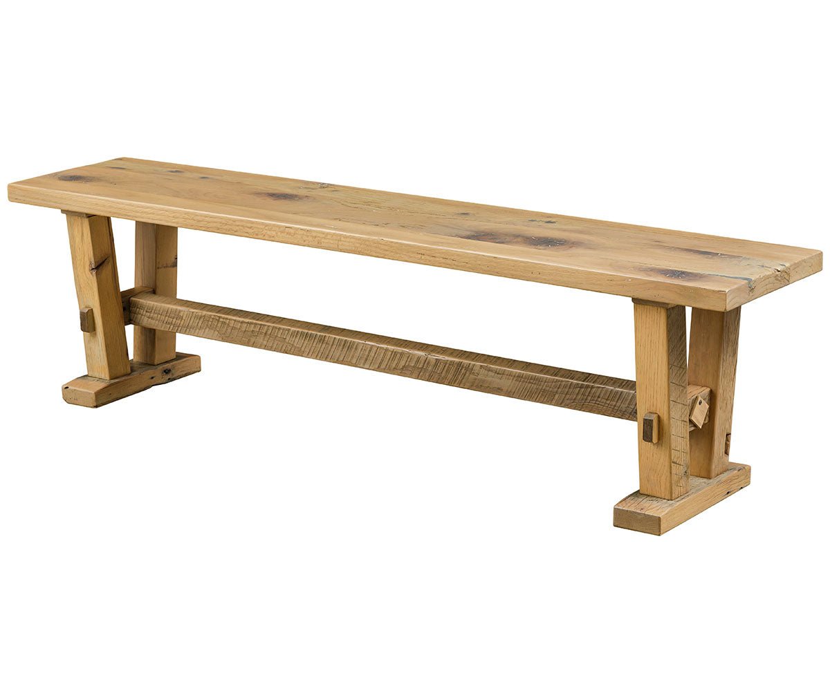Timber frame trestle dining bench in reclaimed pine with pegged mortise joinery and a rough sawn stretcher, on a white background