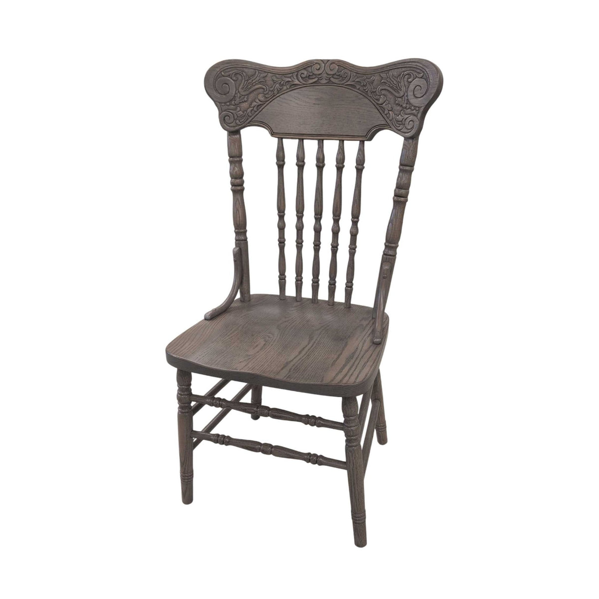 Weathered gray pressback dining chair with an embossed scroll crest, turned spindles and contoured oak seat