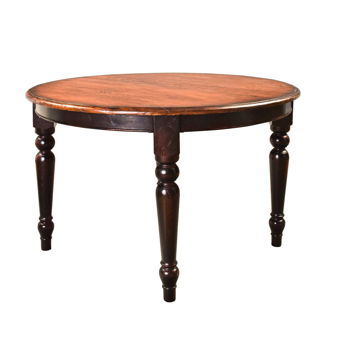 Round extension dining table with a warm cherry top and dark turned legs on a white background
