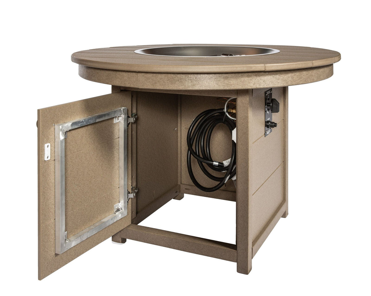 Tan poly propane fire pit table, door swung open to show the gas line coiled inside and the burner pan above