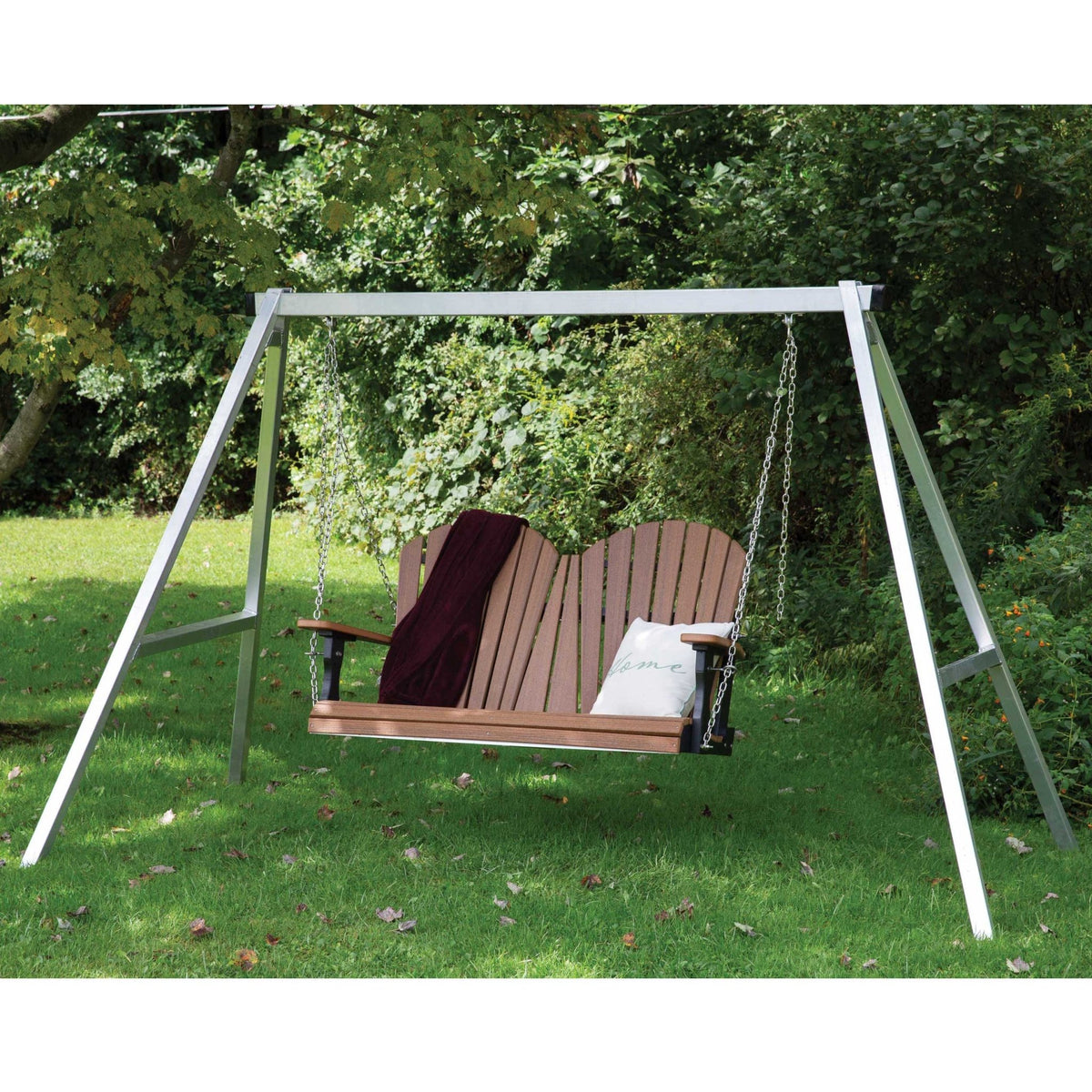 Galvanized aluminum A-frame swing stand in a yard holding a cedar poly porch swing with a blanket and pillow