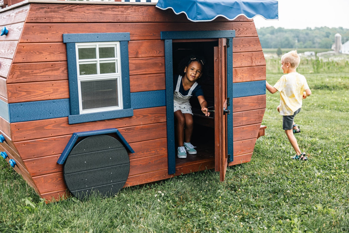 Scout Camper Wooden Swing Set & Playset Kit – real-world photo (configuration and colors may differ from the layouts offered)