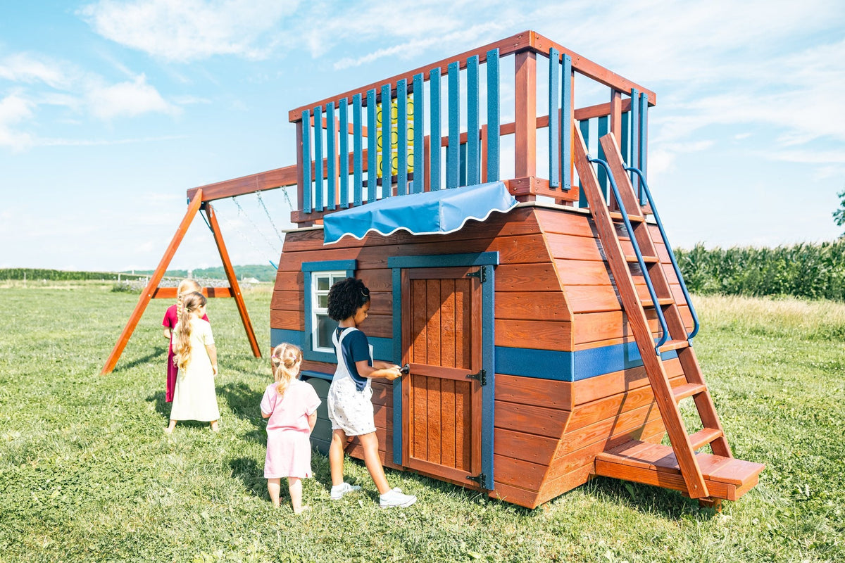 Scout Camper Wooden Swing Set & Playset Kit – real-world photo (configuration and colors may differ from the layouts offered)