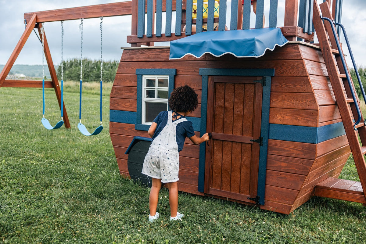 Scout Camper Wooden Swing Set & Playset Kit – real-world photo (configuration and colors may differ from the layouts offered)