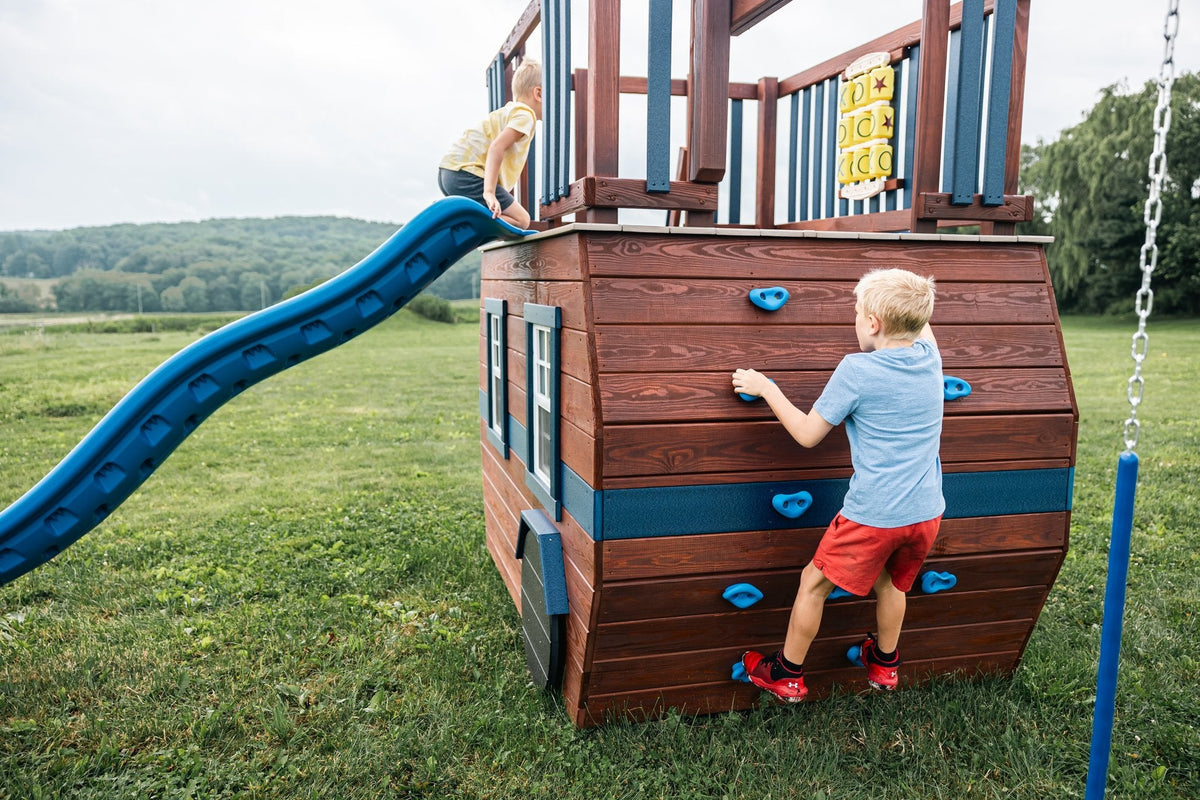 Scout Camper Wooden Swing Set & Playset Kit – real-world photo (configuration and colors may differ from the layouts offered)