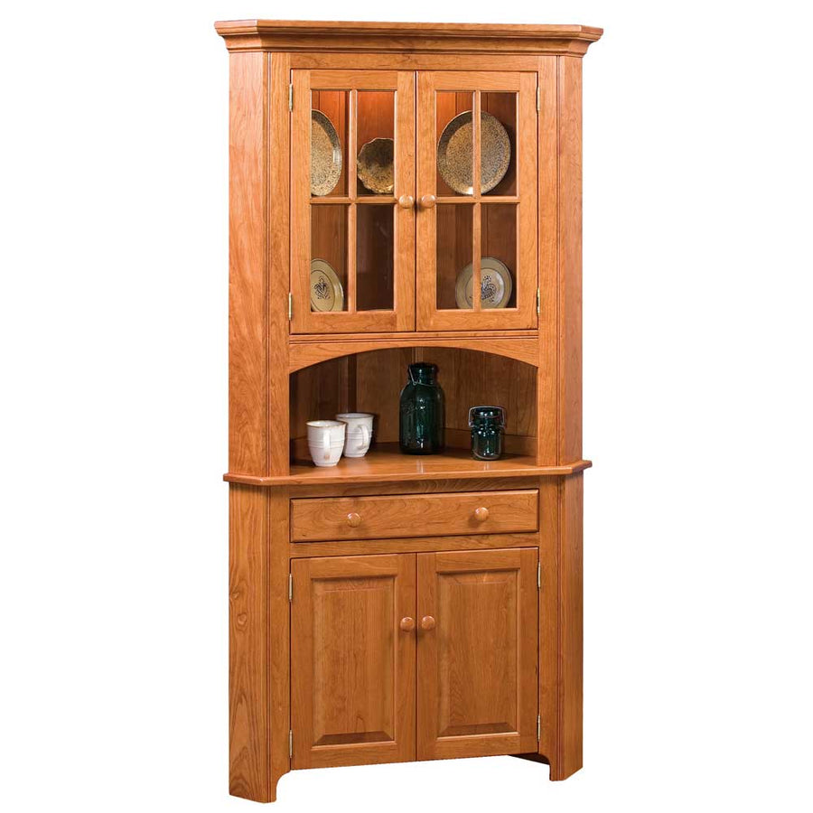 Shaker corner china cabinet in cherry with glass upper doors, arched open shelf, wide drawer and two raised panel base doors